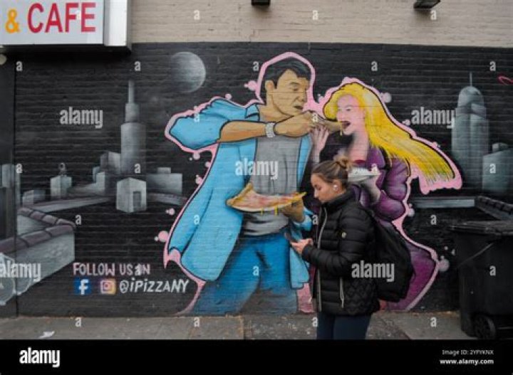 A person walks past a graffito showing late George Floyd, in Berlin, Germany, 30 May 2020. A bystander's video posted online on 25 May, appeared to show George Floyd, 46, pleading with arresting officers that he couldn't breathe as an officer knelt on his neck in Minneapolis, Minnesota. The unarmed black man later died in police custody. A series of demonstrations throughout the German capital, calling for ending of the social and economical restrictions imposed due to the coronavirus pandemic. The events are organised by groups of various motives, right wing activists, conspiracy theory believers and more, several counter demonstrations by left leaning organisations were also taking place. Anti-restrictions protests and counter demos in Berlin, Germany - 30 May 2020