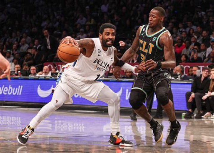 Brooklyn Nets guard Kyrie Irving (11) listens during a time out in the second half of an NBA basketball game against the Washington Wizards, Saturday, Feb. 1, 2020, in Washington. The Wizards won 113-107. (AP Photo/Nick Wass)