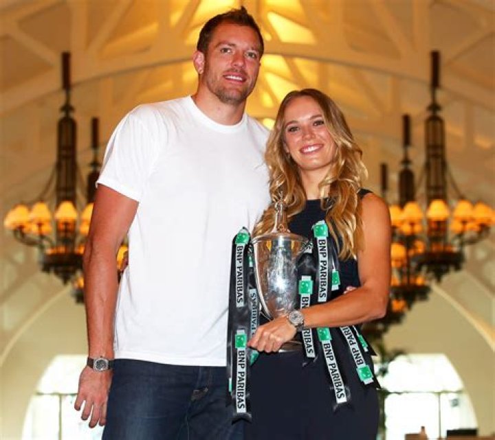 Caroline Wozniacki and David Lee attend a party