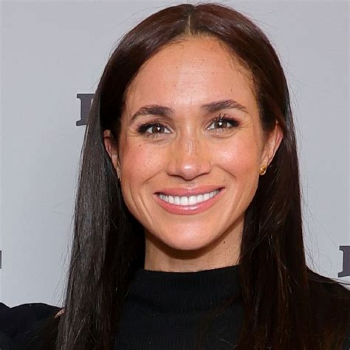 Meghan Markle in a Ruffled Navy Blue Dress