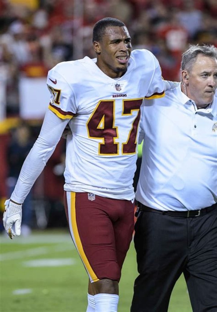 Quinton Dunbar grimaces after an injury.